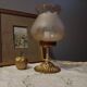 Bronze foot table lamp, satin amber lampshade, circa 1960
