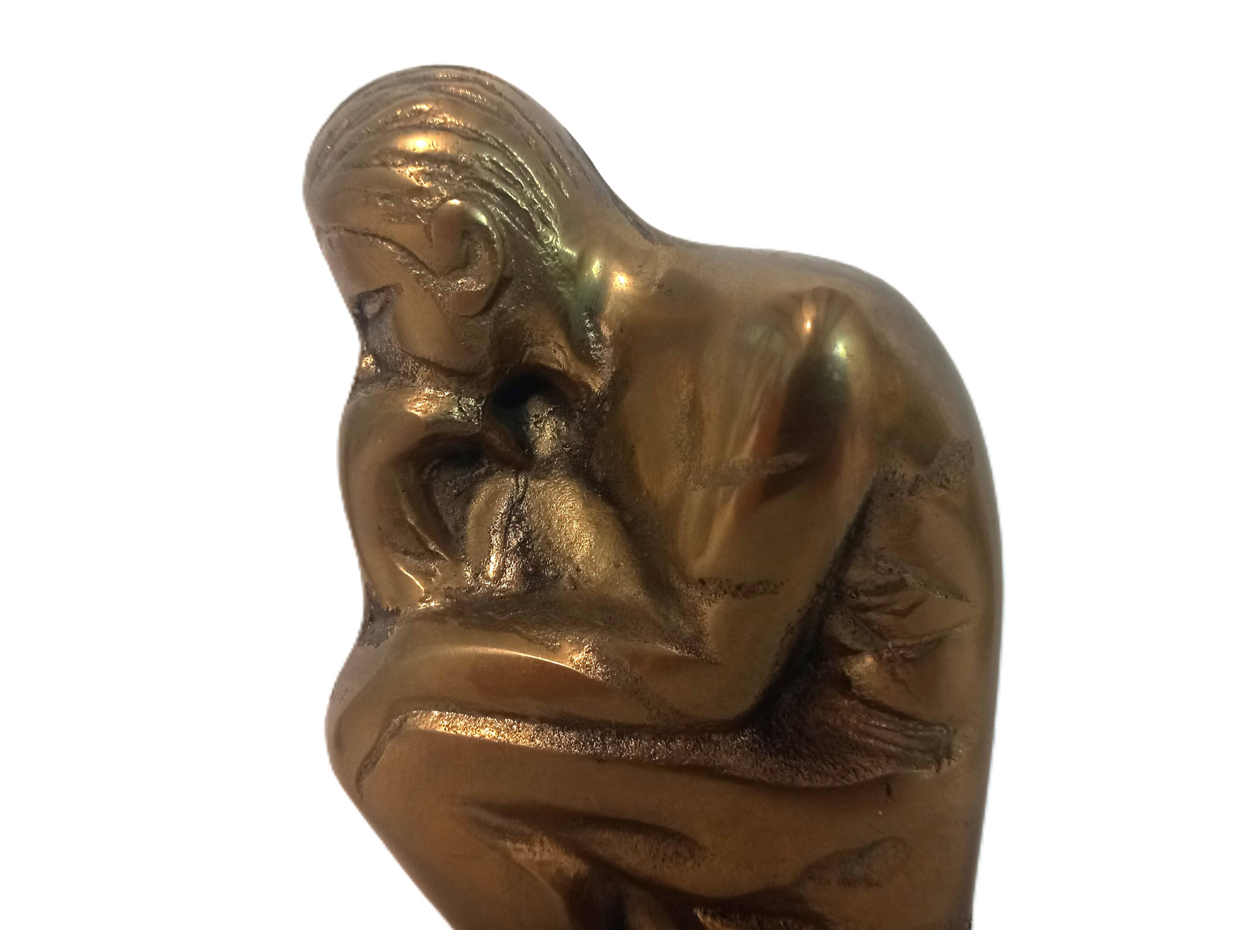 Pair of brass "thinker" bookends