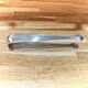 Antique sugar tongs in silvered metal