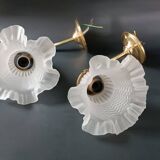 Brass and frosted glass wall lights