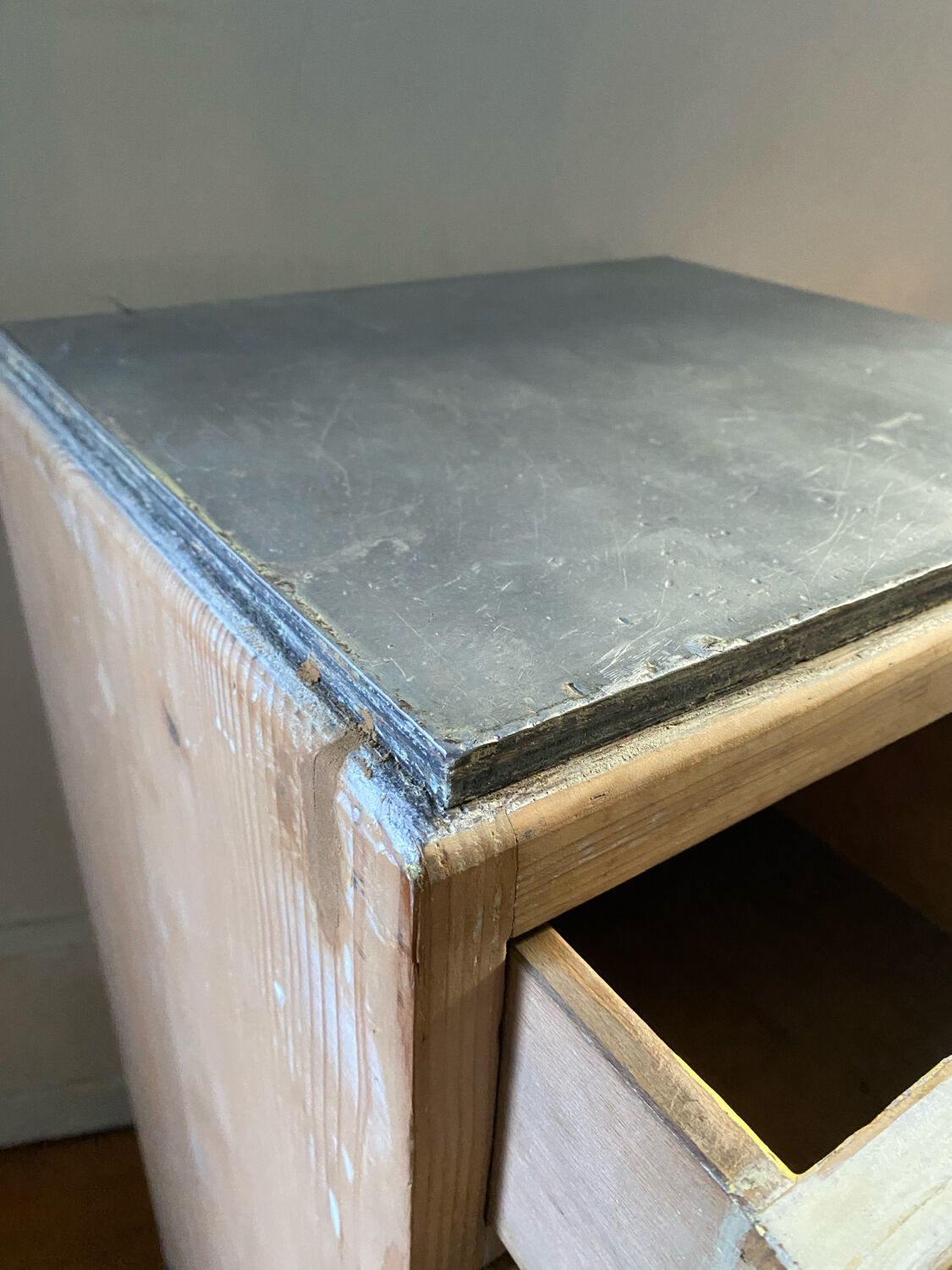 Vintage antique workshop cabinet with 12 drawers in raw wood.
