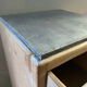 Vintage antique workshop cabinet with 12 drawers in raw wood.