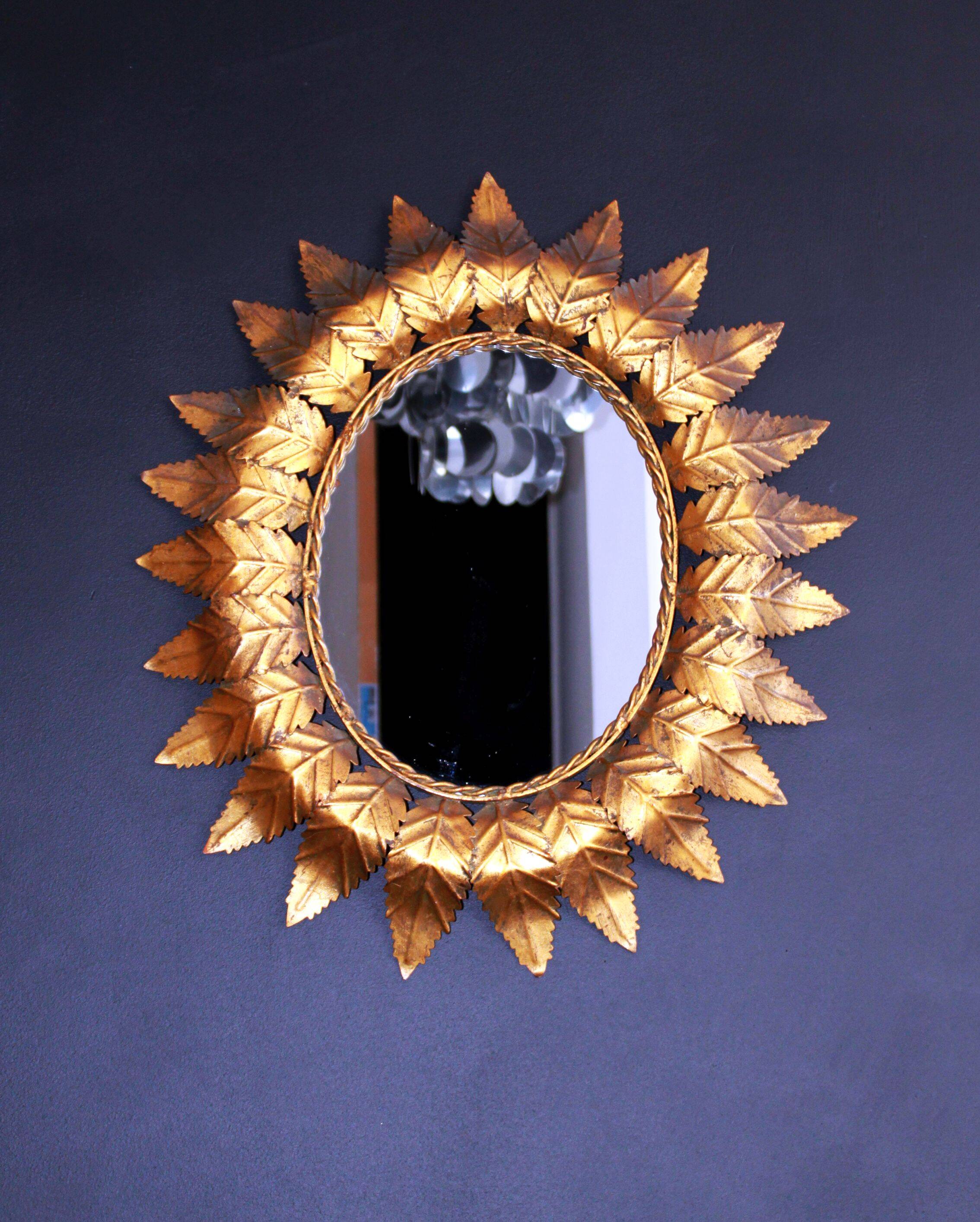 Oval sun mirror, 61x52cm.