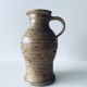 Pitcher in sandstone pyrity signed