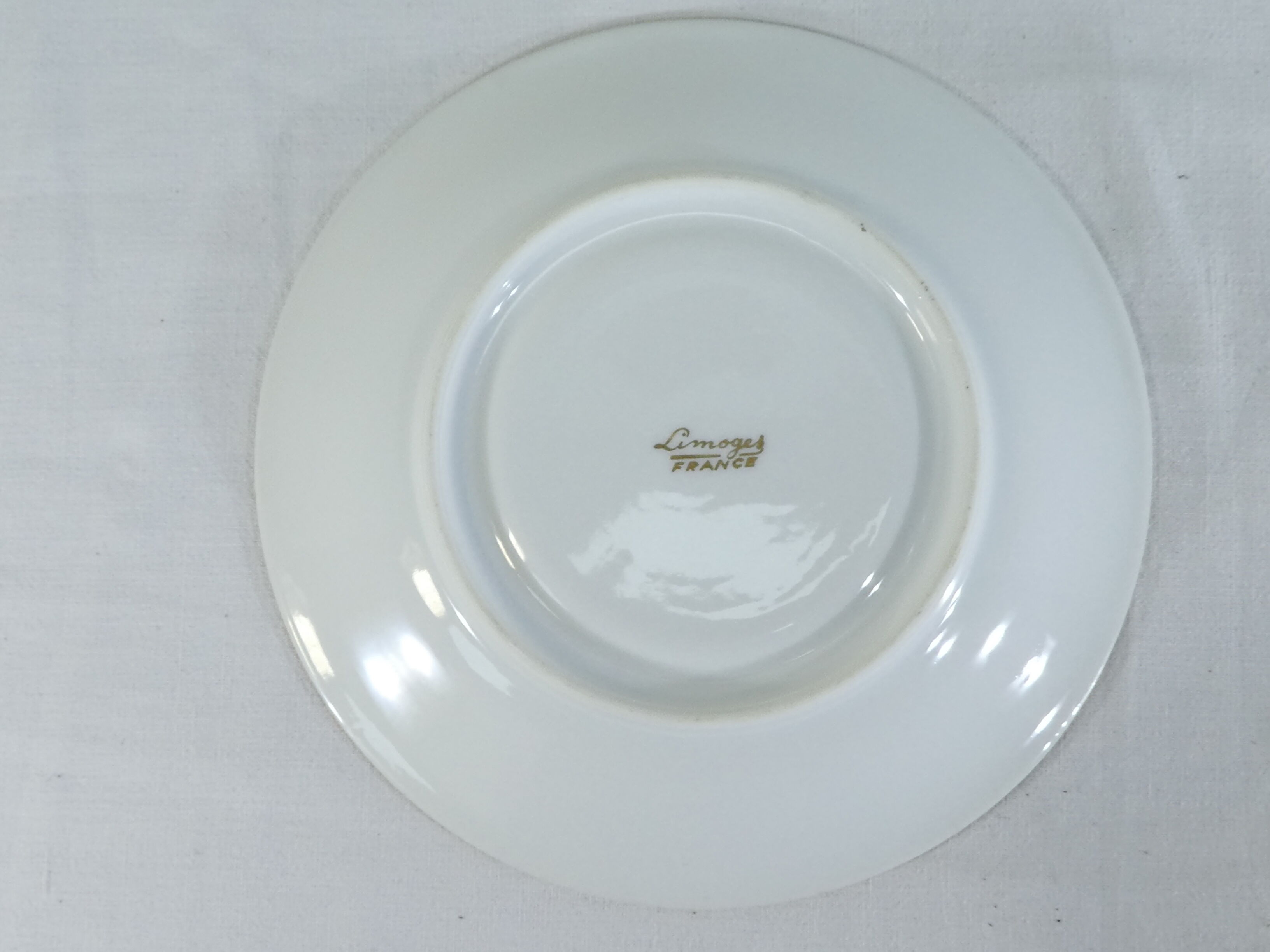 Green and gilded LIMOGES porcelain cup and cup lunch