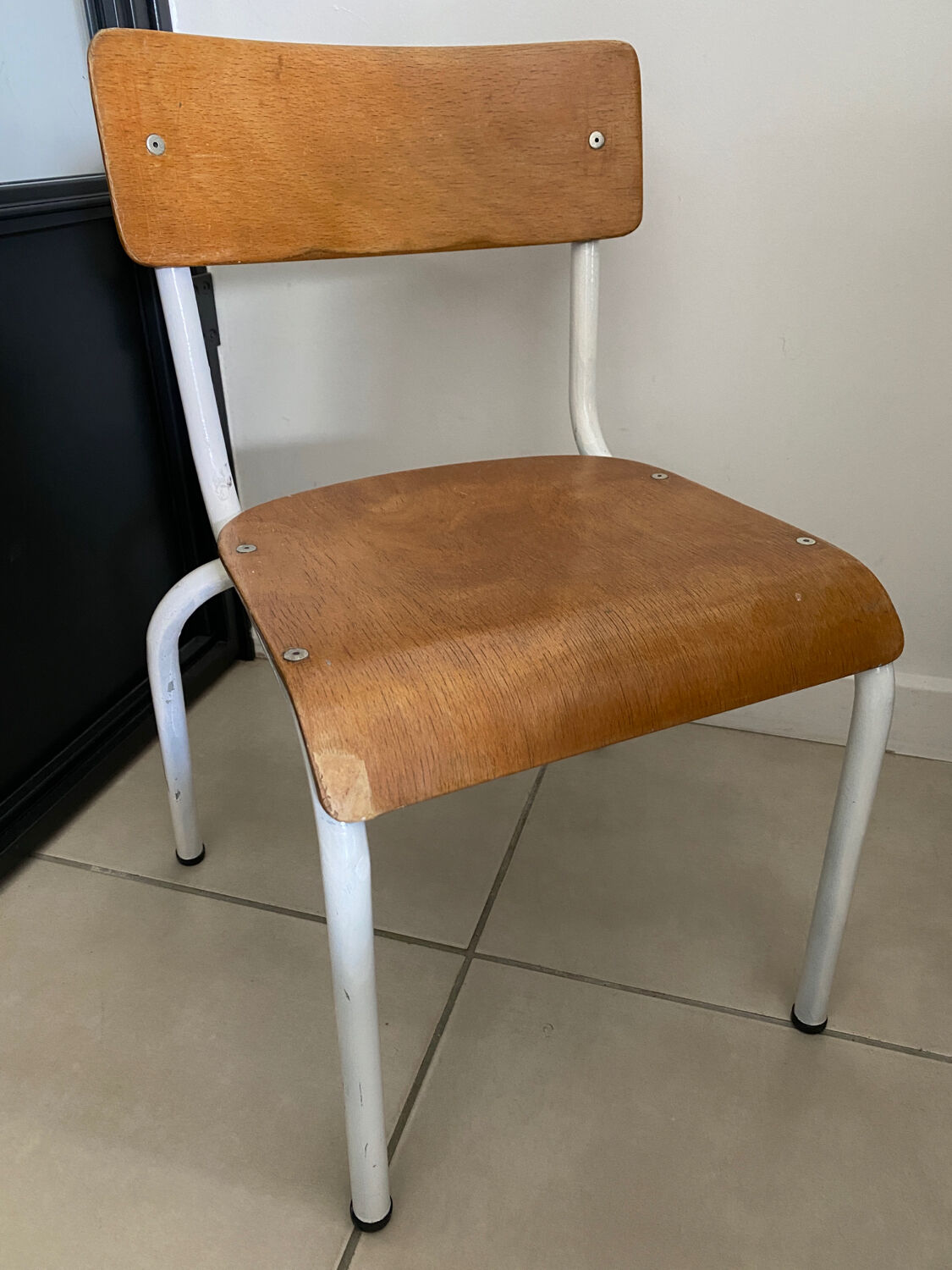 Old wooden and metal children's school chair