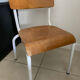Old wooden and metal children's school chair