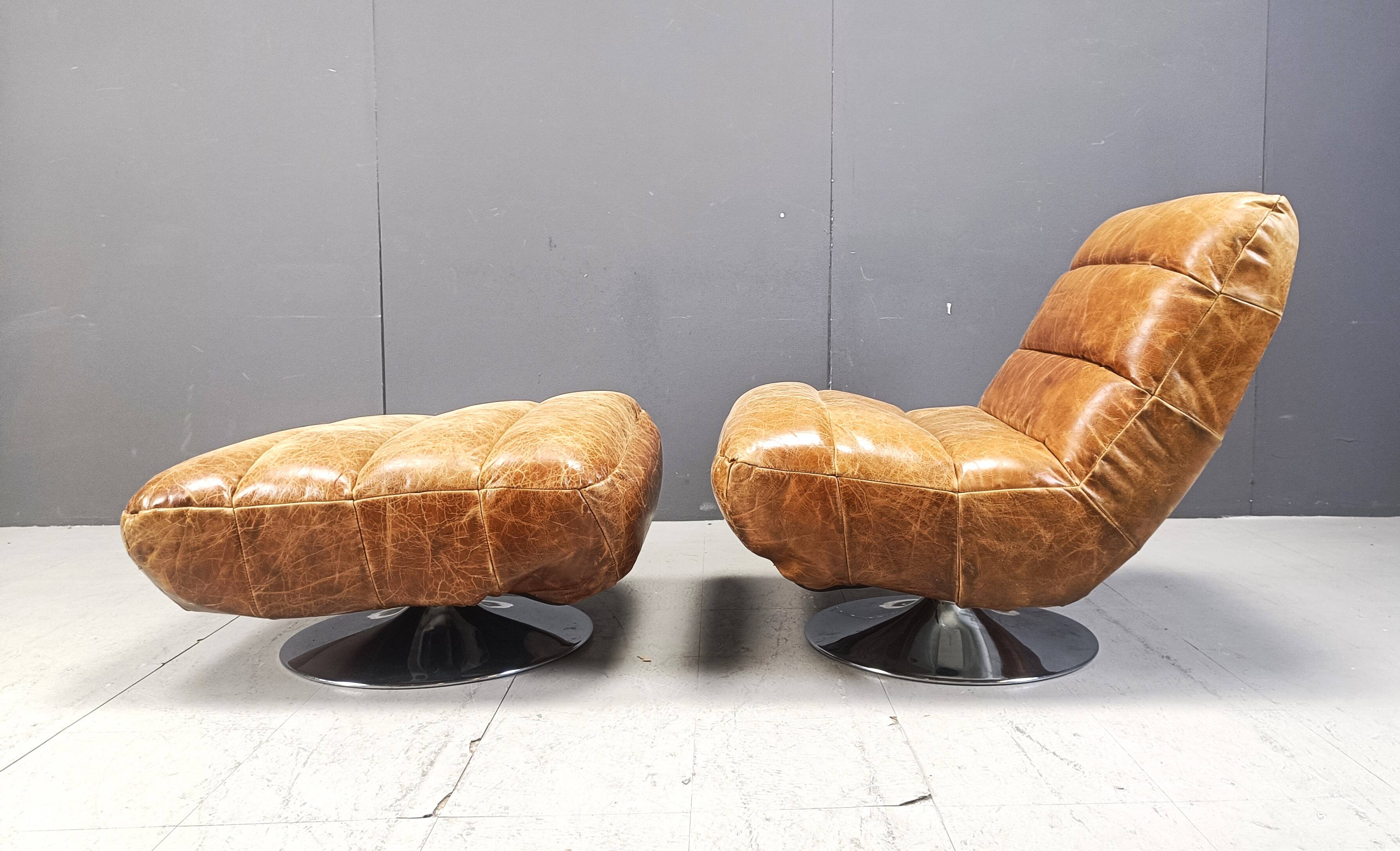 Vintage leather swivel chair with stool, 1970s