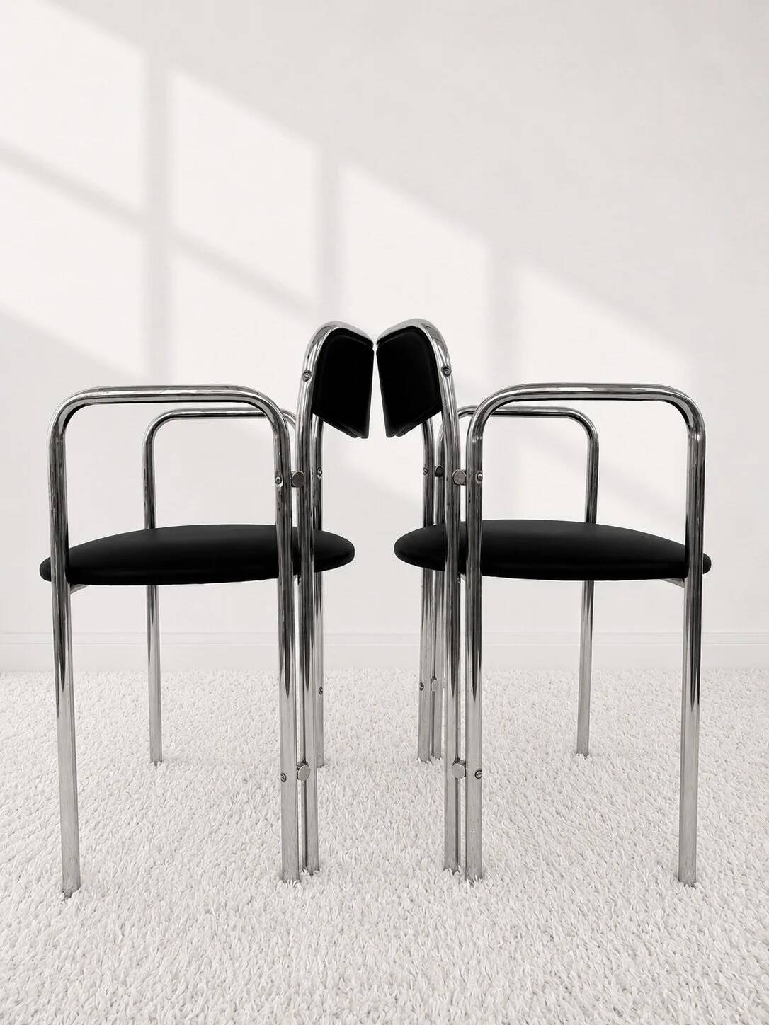 Vintage chairs with double chrome structure and black velvet. 70s