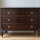 Antique Louis XVI commode in brown wood and gilded brass.