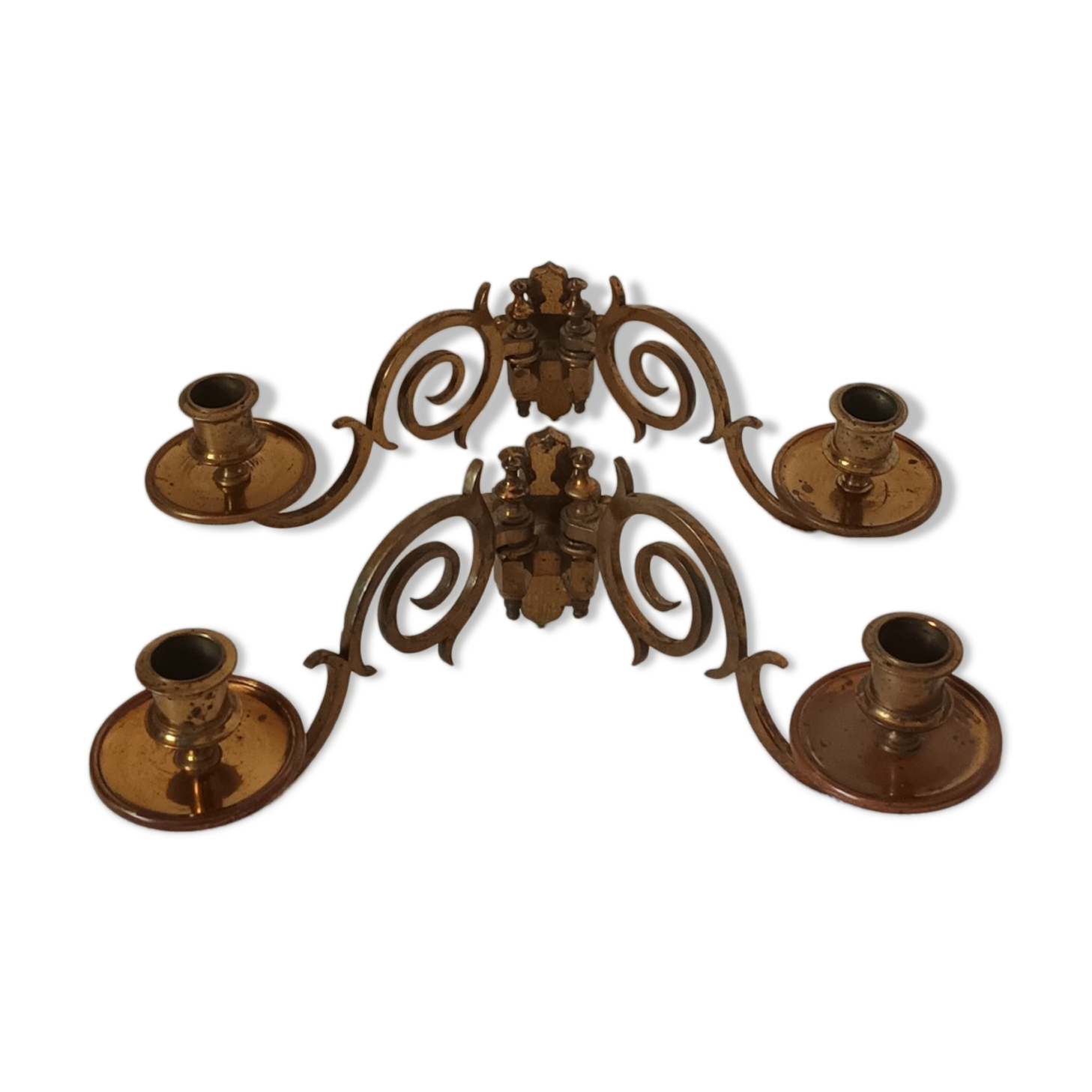 Pair of antique wall-mounted brass candle holders
