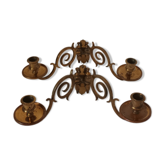 Pair of antique wall-mounted brass candle holders