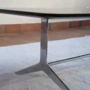 70s design coffee table with a black top and steel legs.