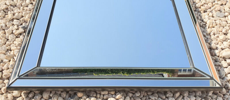 Vintage mirror deknudt with 70's parecloses