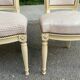 2 chaises Louis XVI en bois beige rembourrées