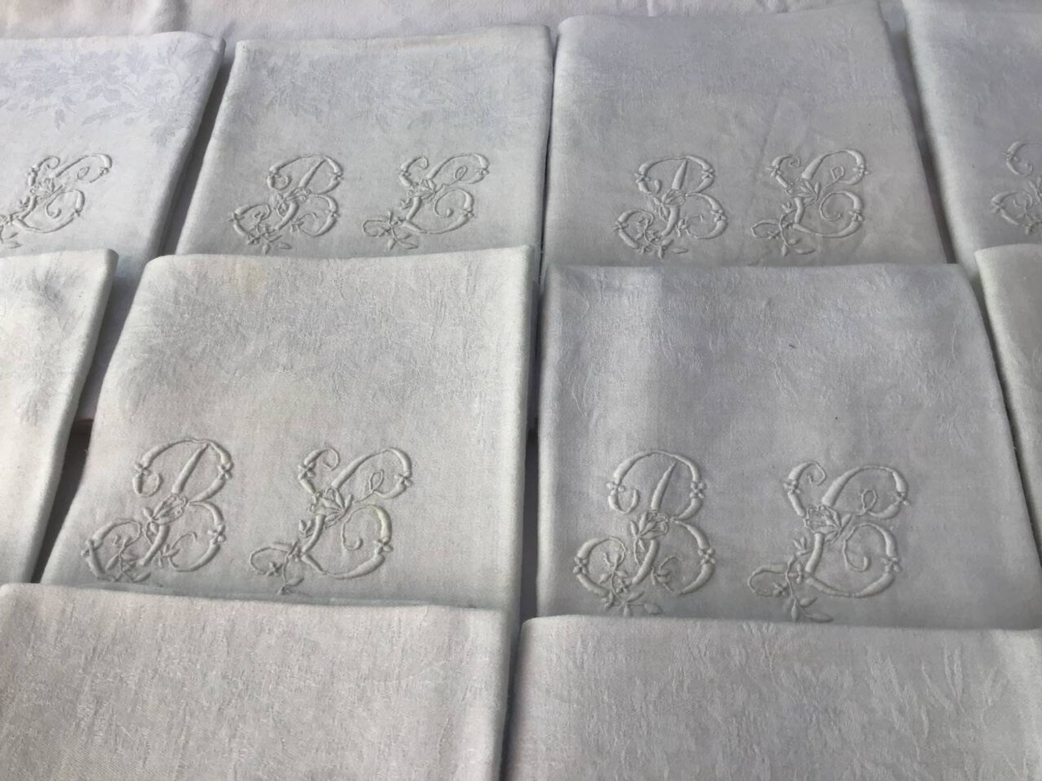 Set of 12 19th century white napkins marked “BL”