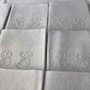 Set of 12 19th century white napkins marked “BL”