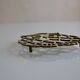 Vintage openwork brass trivet in the shape of an owl or owl