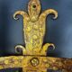 Pair of electrified golden wrought iron gothic wall sconces.