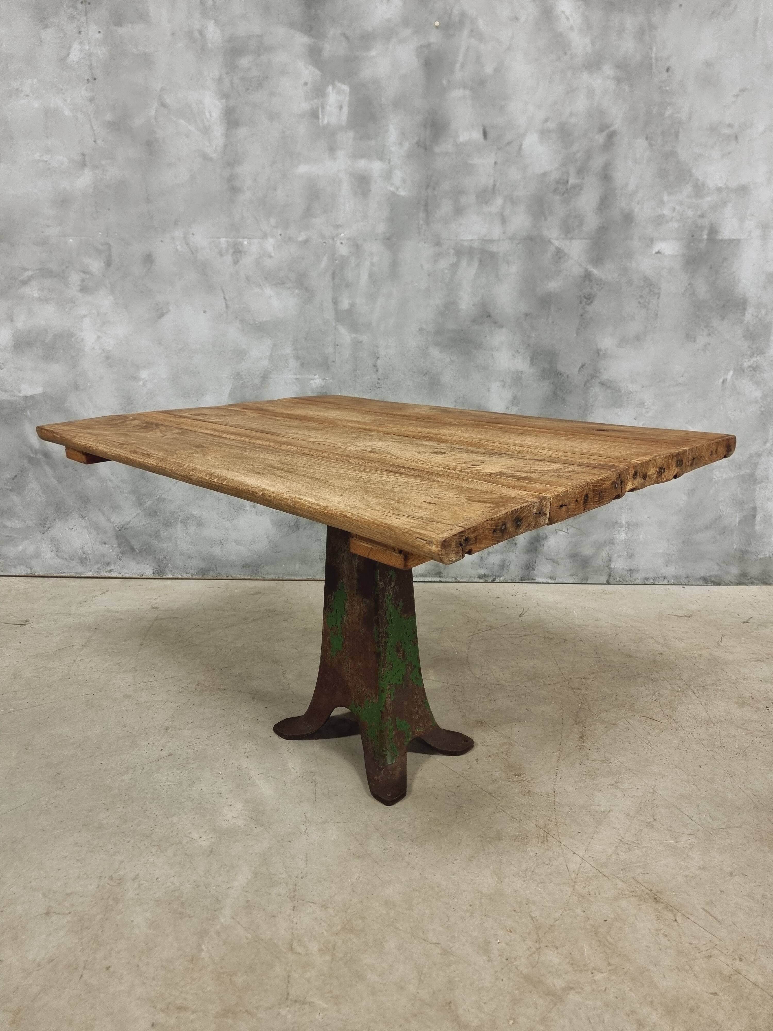Antique oak dining table on cast iron base 93 x 123 cm