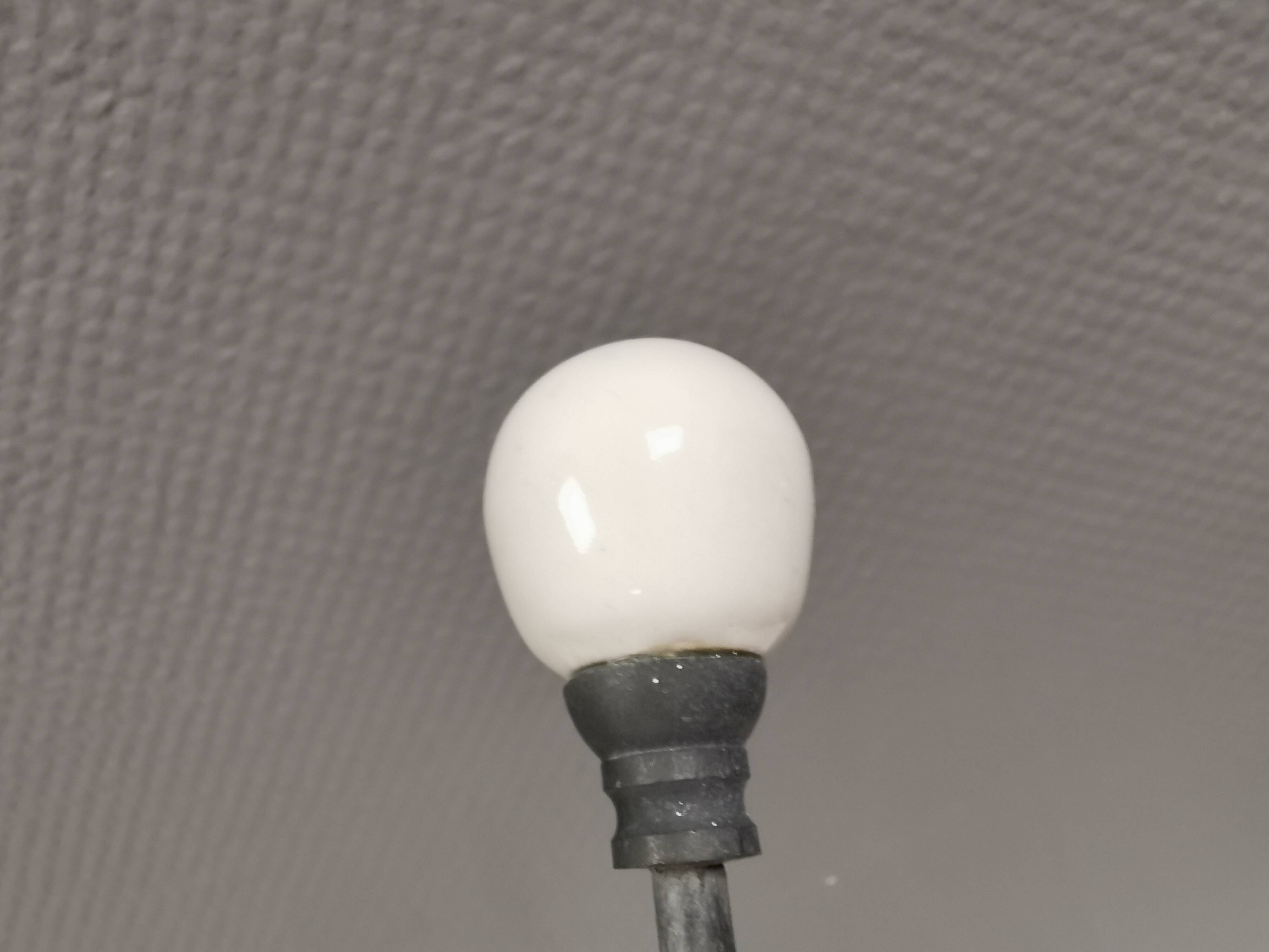 Coat hooks made of galvanized brass and raw white porcelain