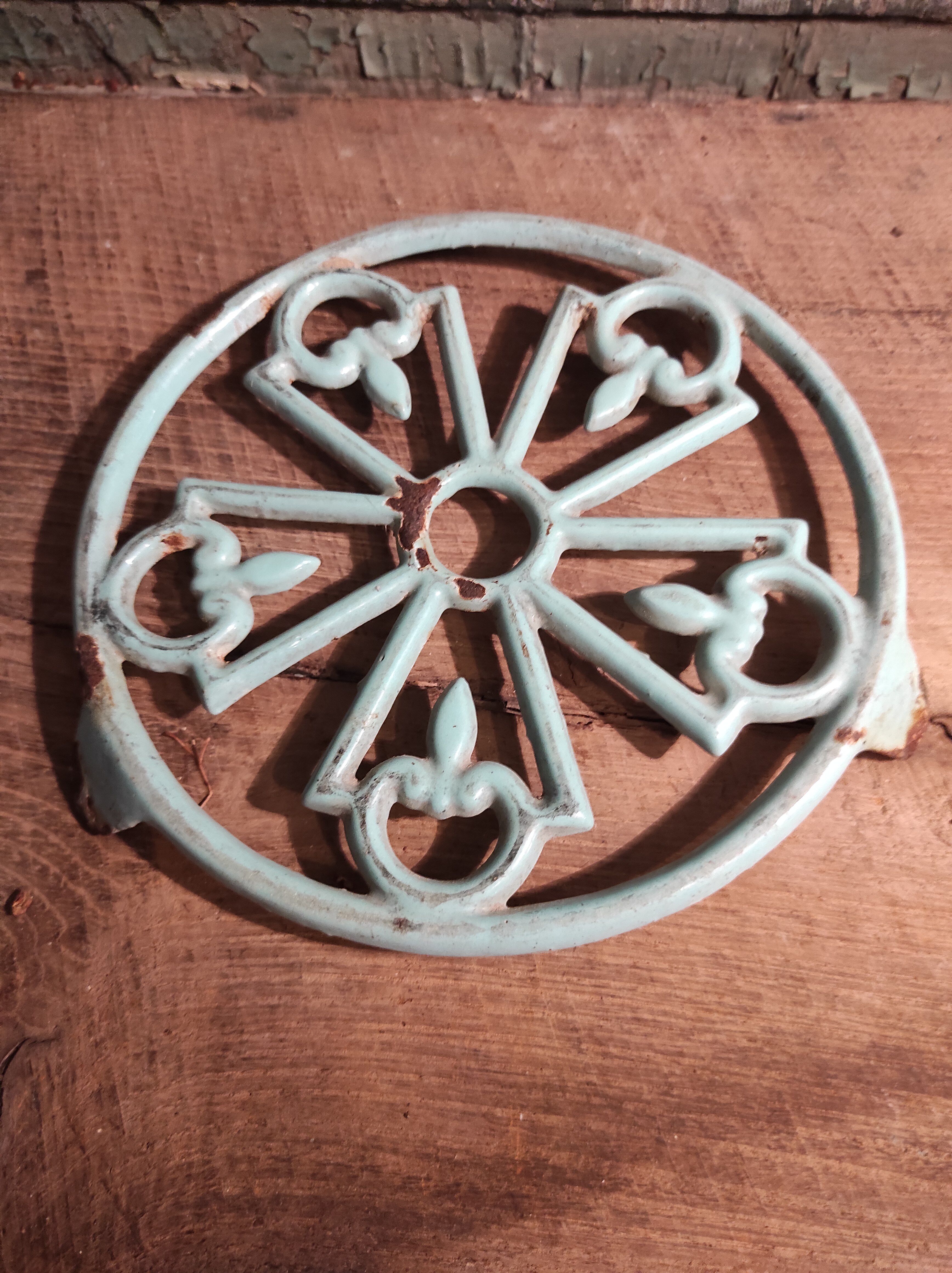 Vintage French light greenish blue cast iron table mat