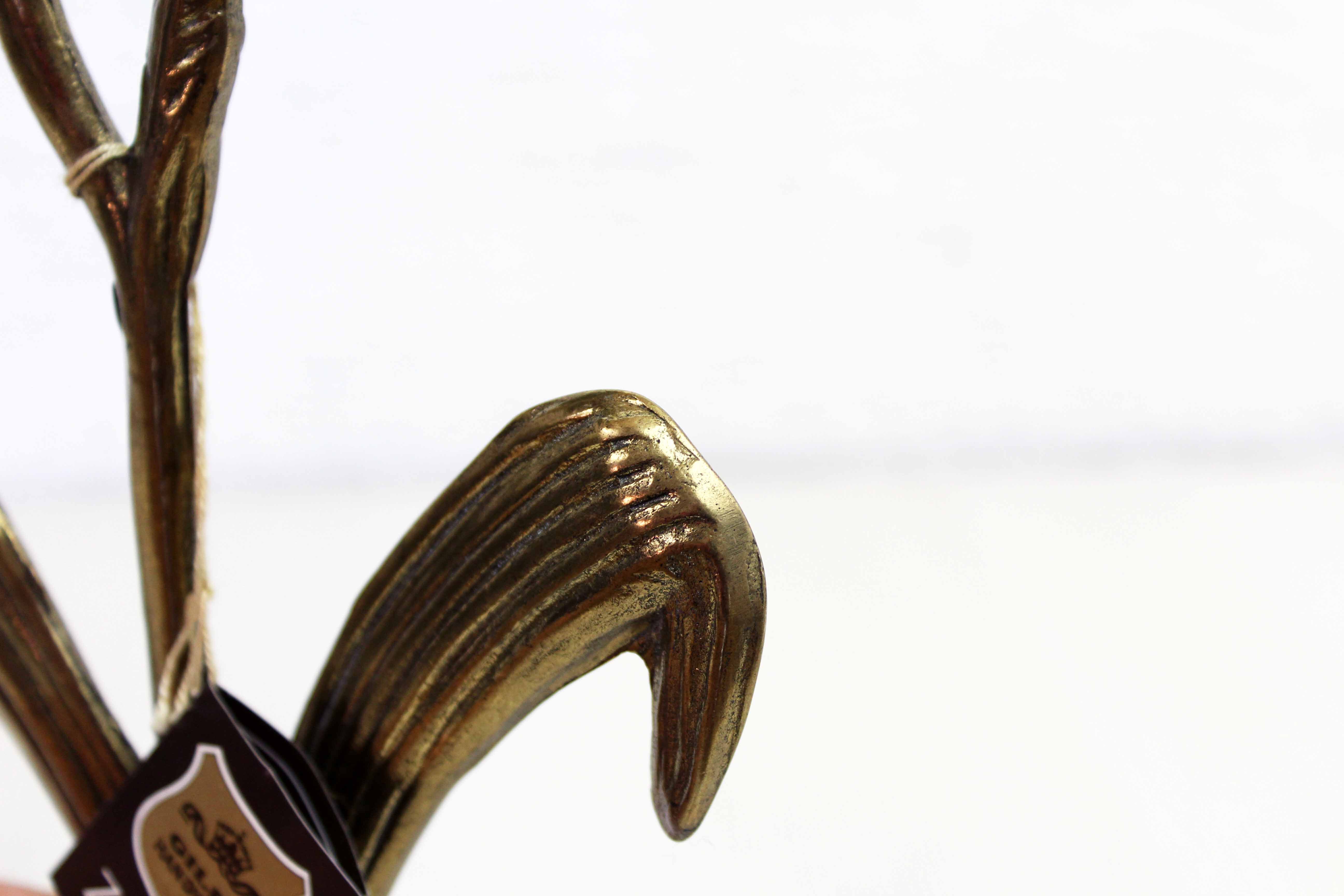 Art Nouveau brass flower candle holder