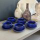 Set of 5 blue Klein ceramic tea cups with saucers.