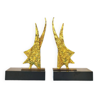 Golden bronze bookends brutalist design