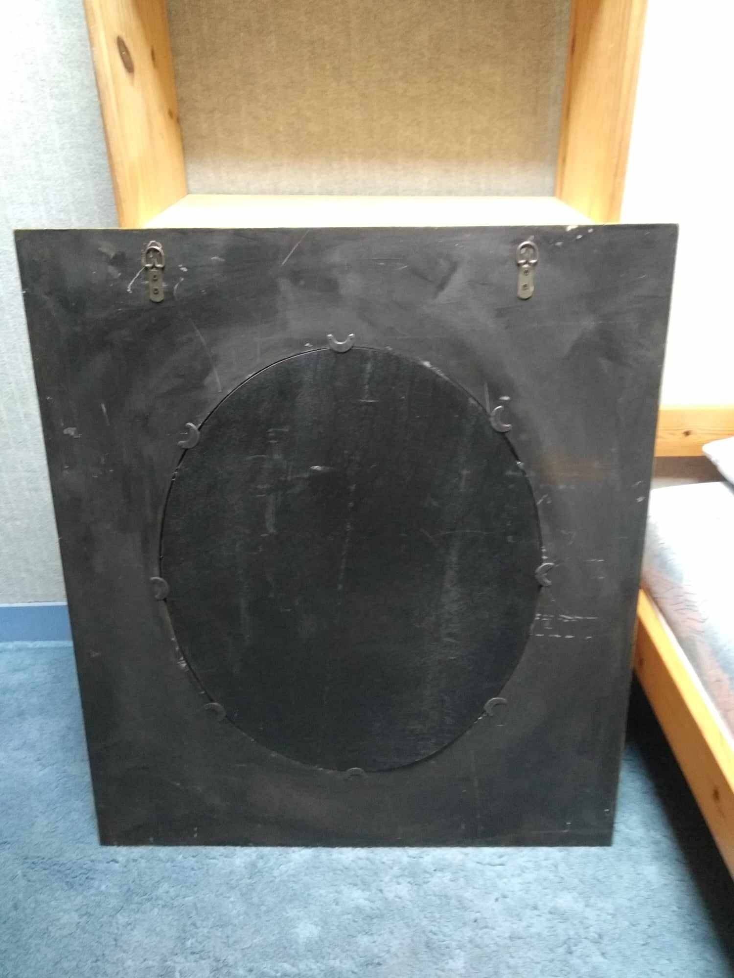 Oval mirror in duck pattern frame