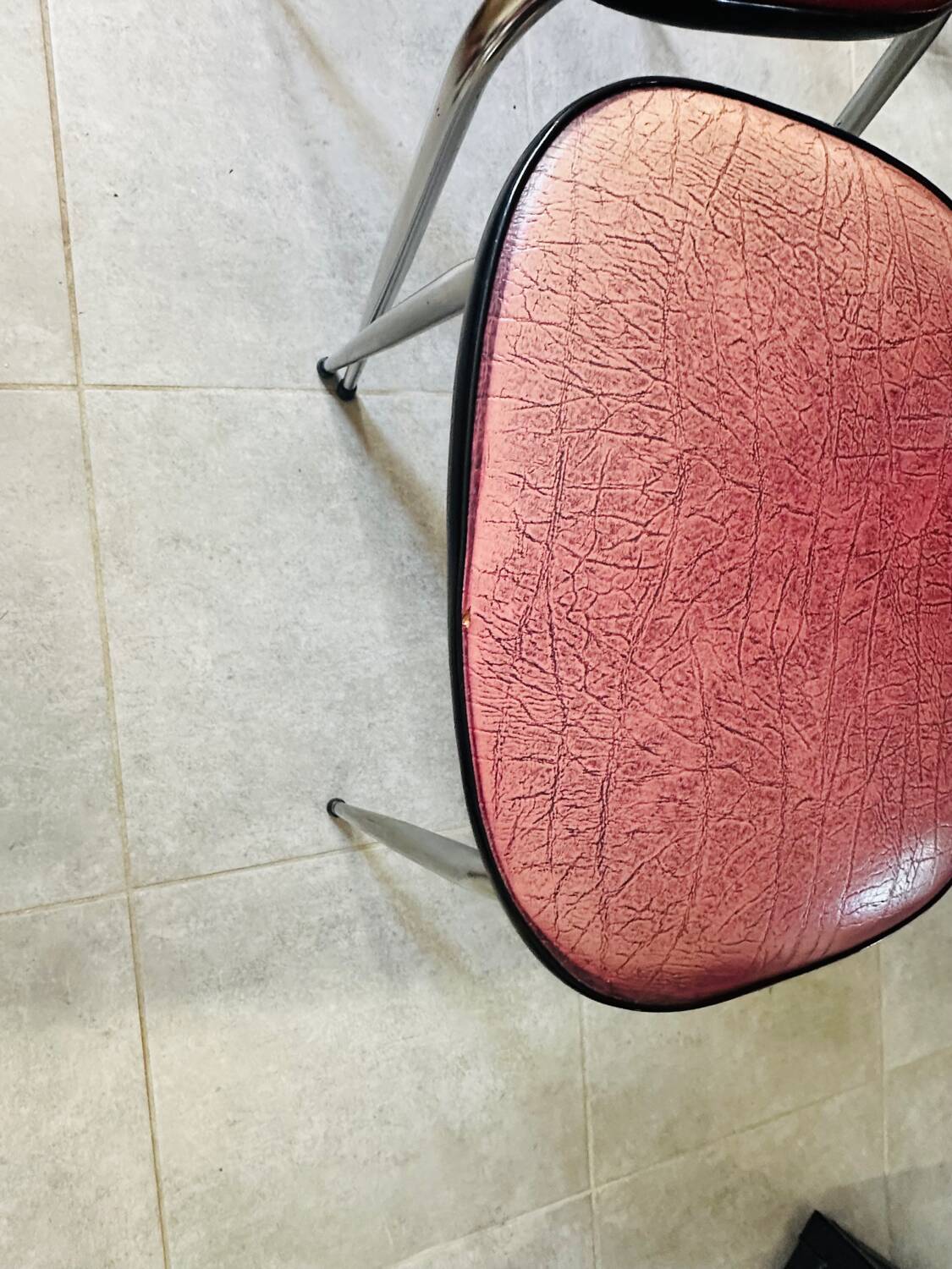 Pair of raspberry-colored chairs from the 60s/70s with metal legs