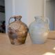 Duo of brown and cream ceramic jugs
