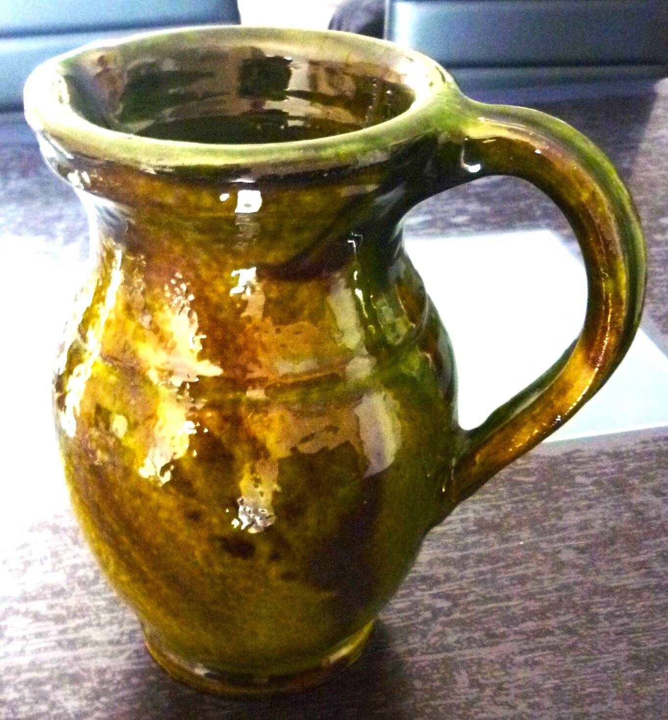 Pitcher vase, thick green glazed terracotta, signature to be identified