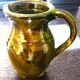 Pitcher vase, thick green glazed terracotta, signature to be identified