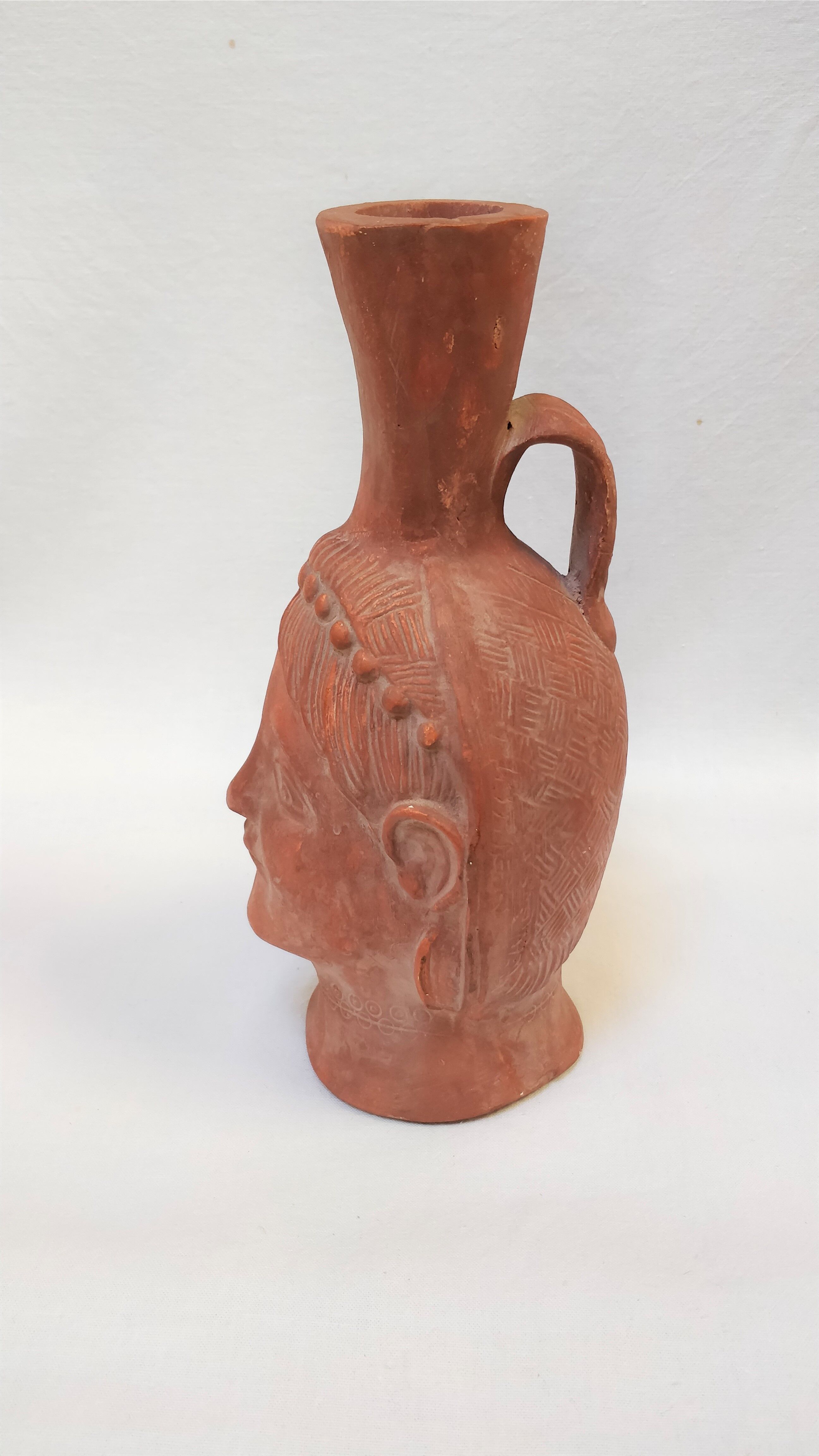 Jug vase with human head