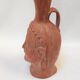 Jug vase with human head