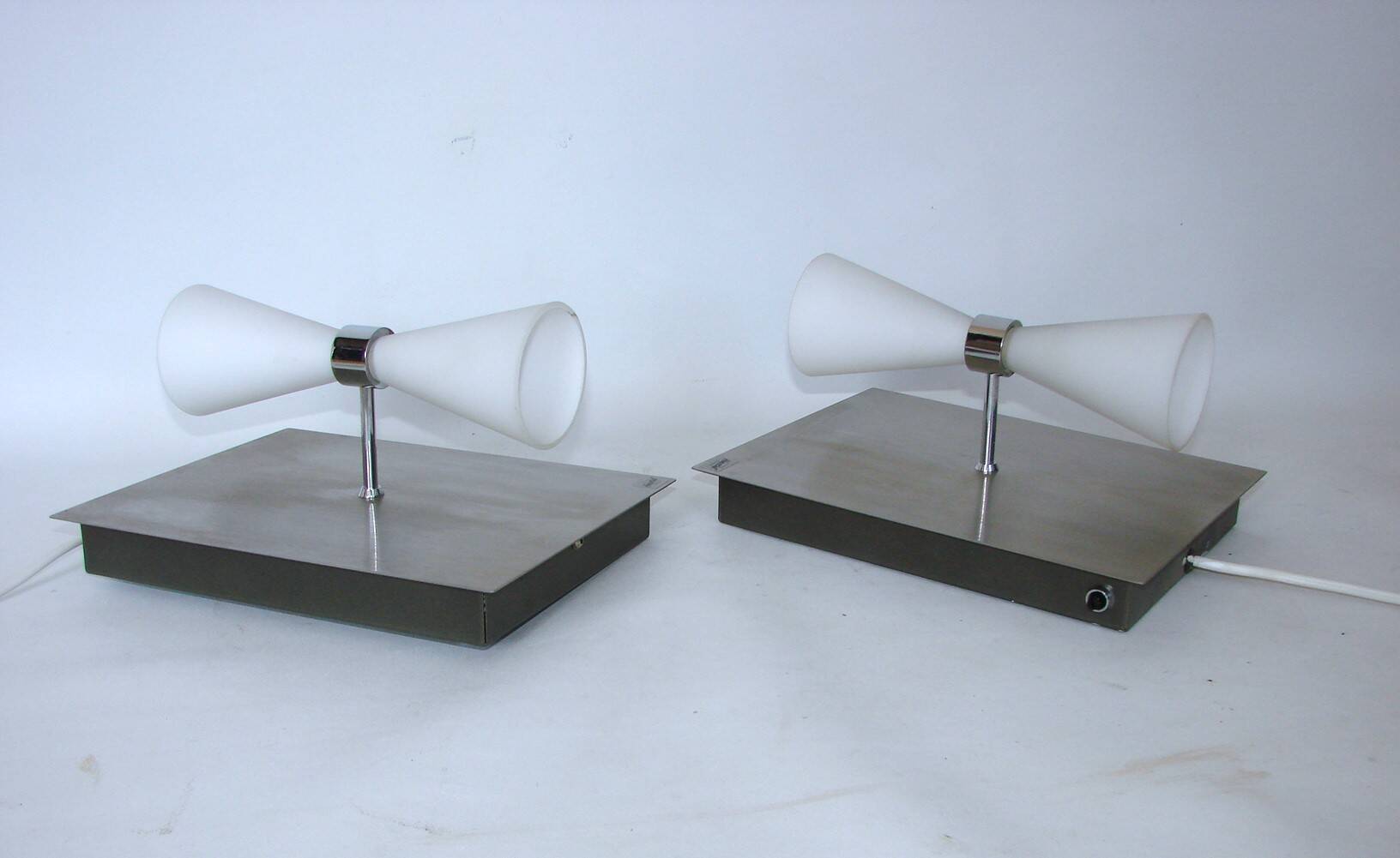 A pair of modern herstal wall lamps from the 2000s - stylish lighting for m
