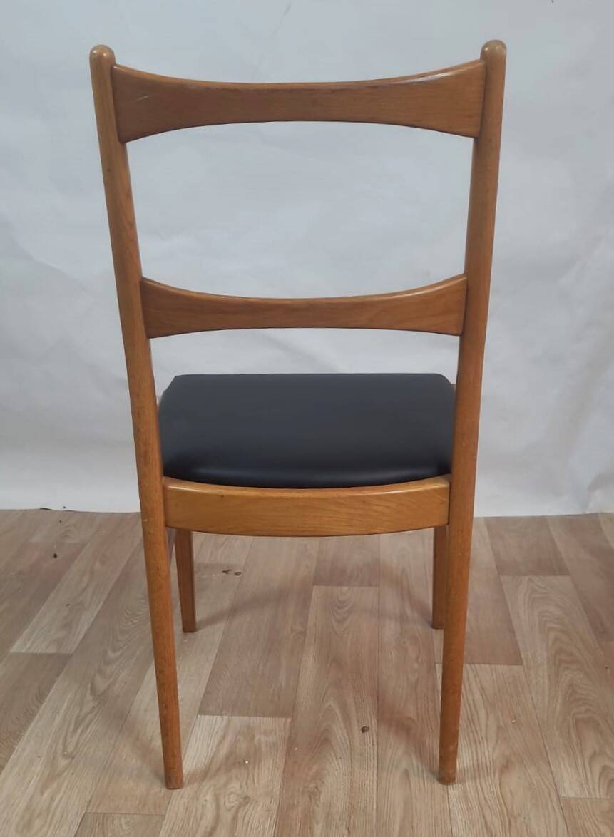 Vintage Danish teak chair – black faux leather seat (1960s)