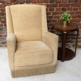 Fauteuil en velour beige et franges