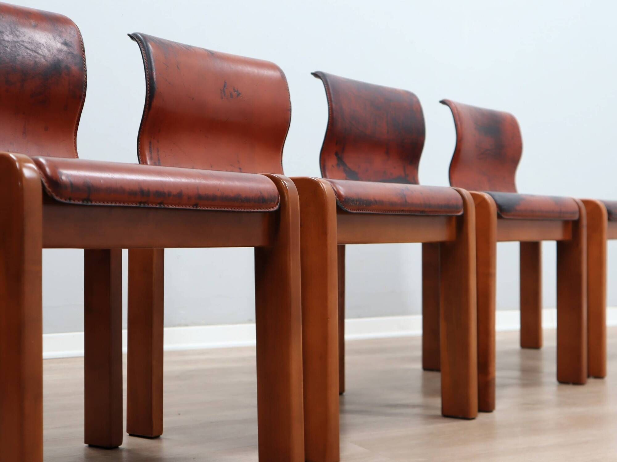 Curved wooden and leather chairs by Afra and Tobia Scarpa from the 1970s, set of 4.
