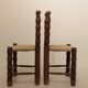Pair of rustic chairs in turned wood with straw seats