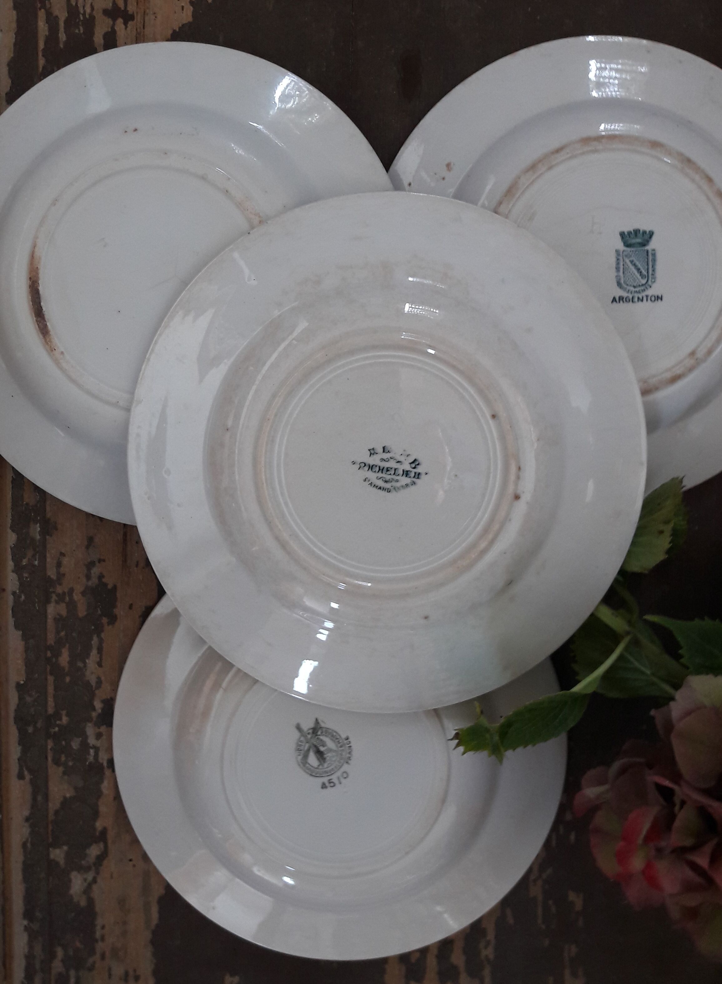 Lot of four mismatched hollow plates