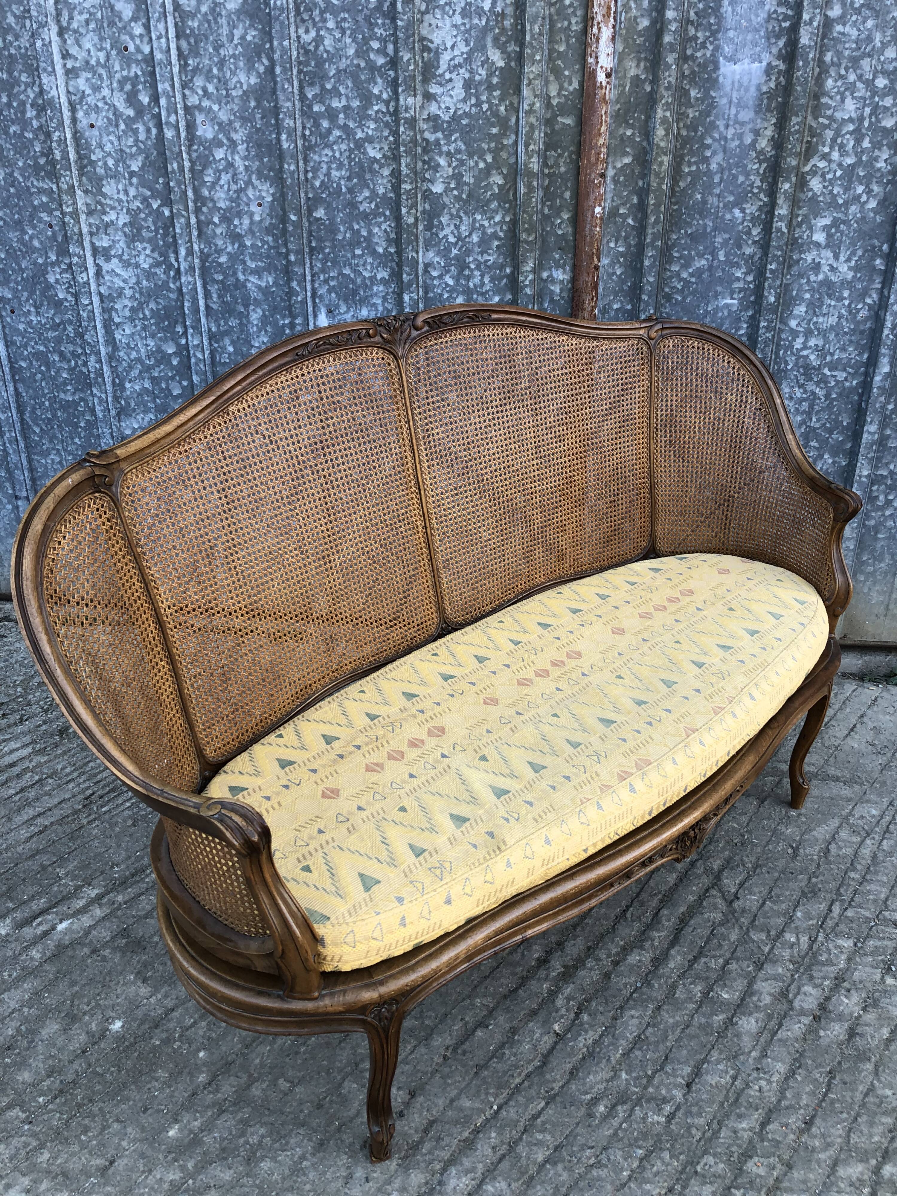 Antique Louis XV bench in solid walnut and caning