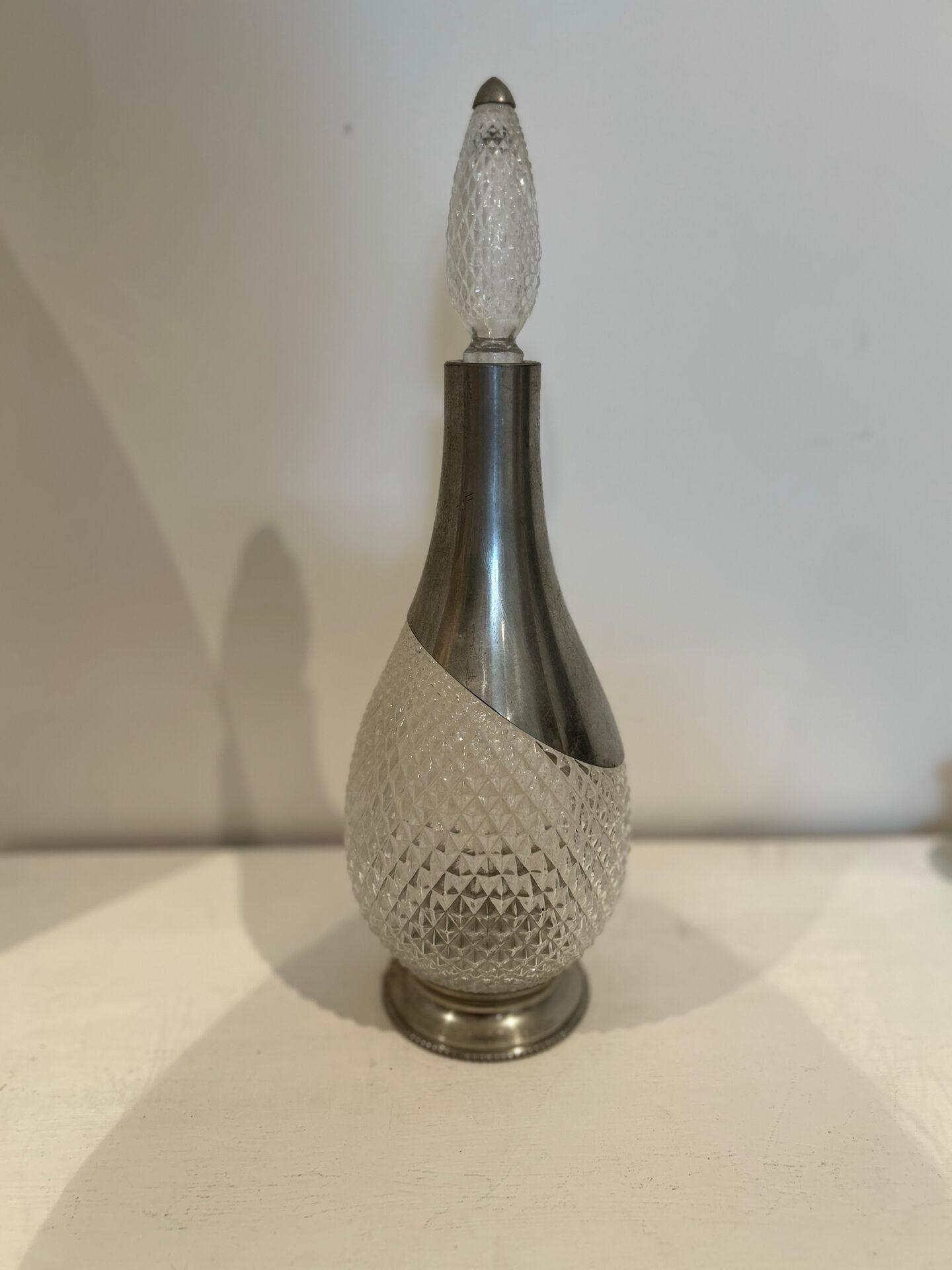 Cut glass carafe and pewter