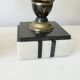 Pair of Art Deco enamelled brass casseroles, black and white marble base
