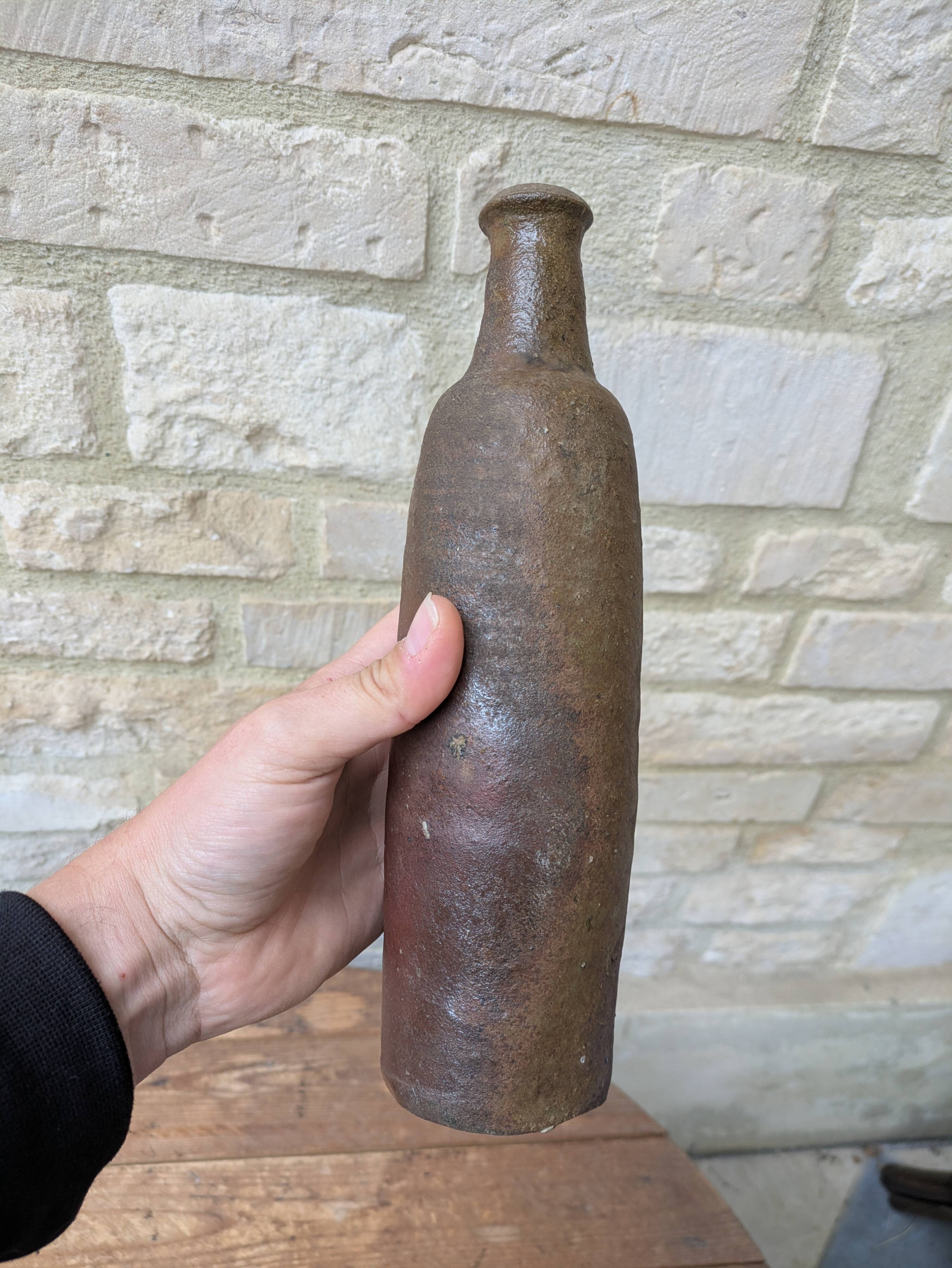 Old handmade terracotta bottle