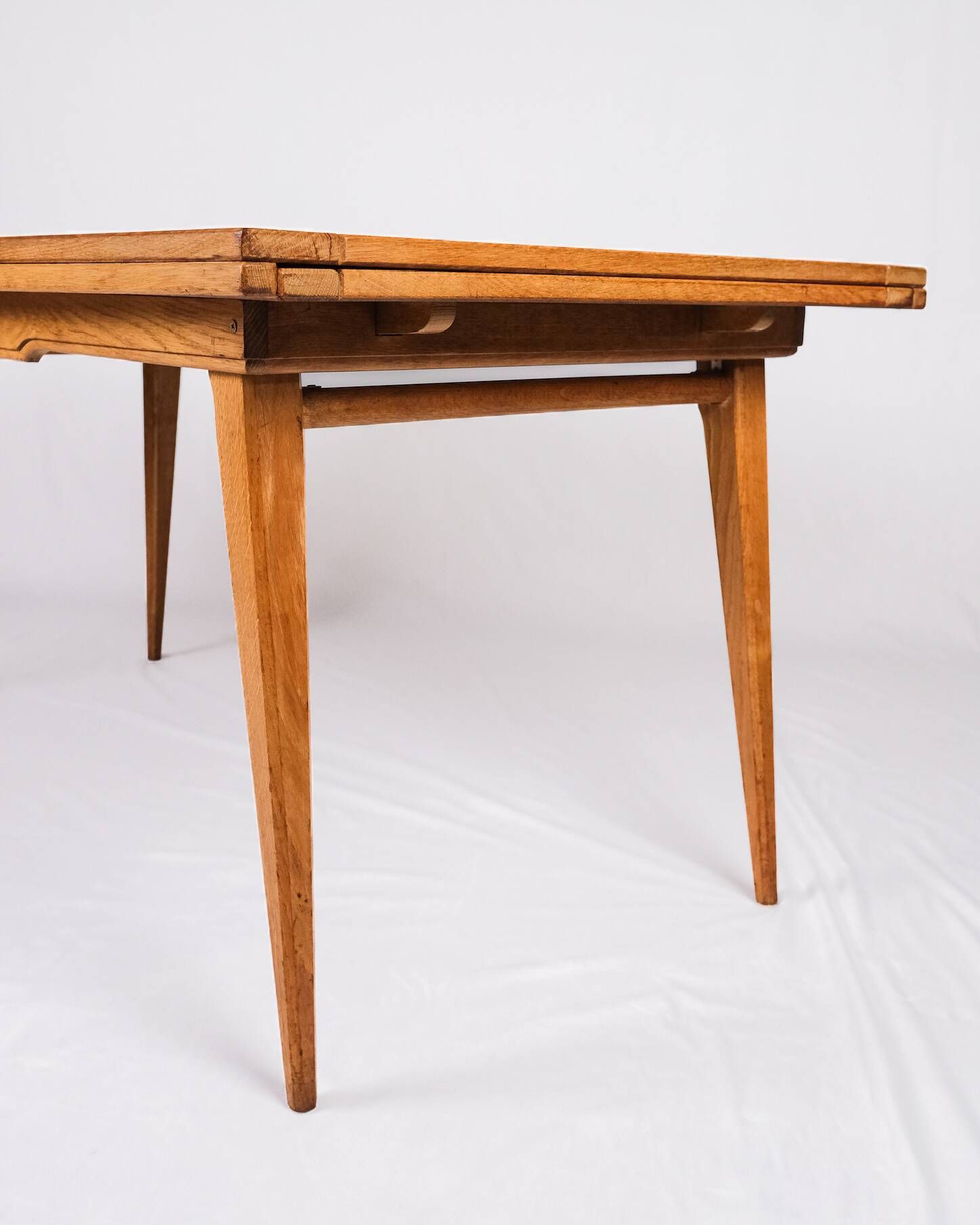 Extendable oak table in the style of Guillerme and Chambron, France 1960s