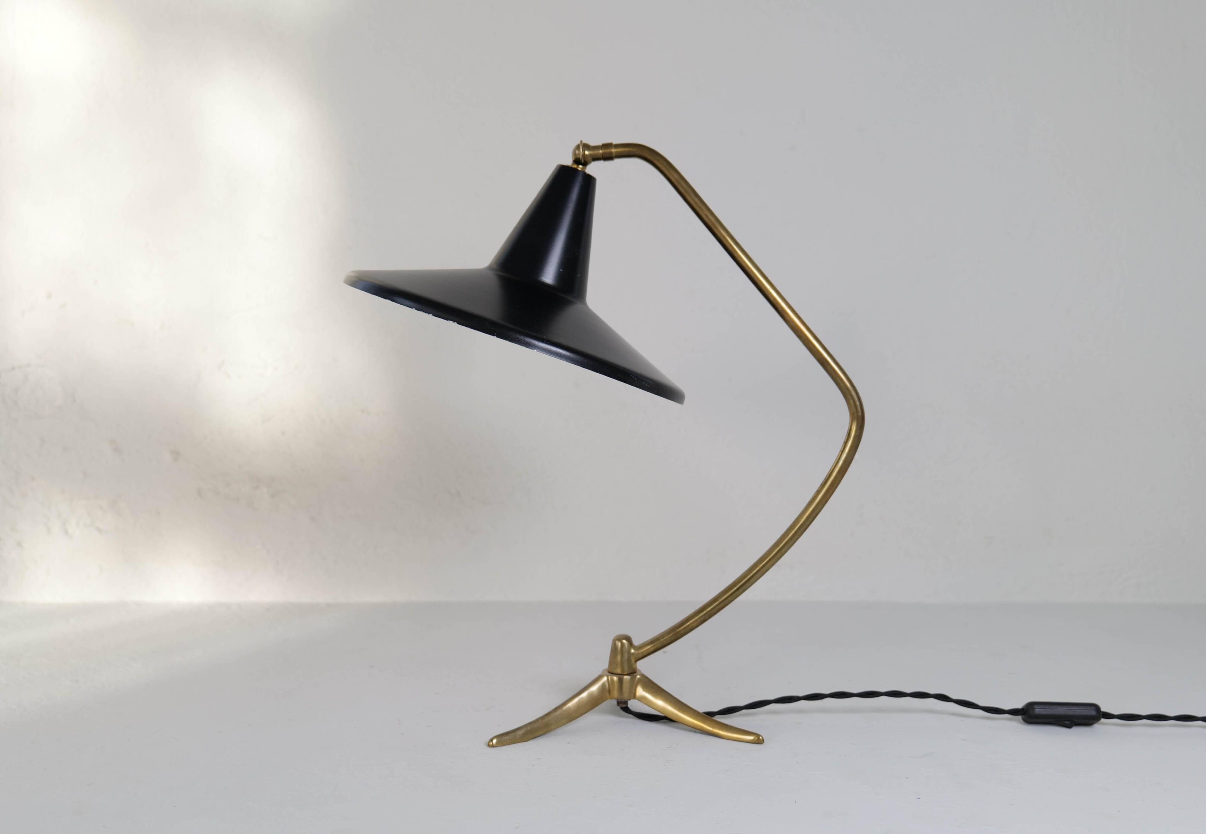 Brass table lamp on a tripod in modern Swedish style, Sweden, 1950.