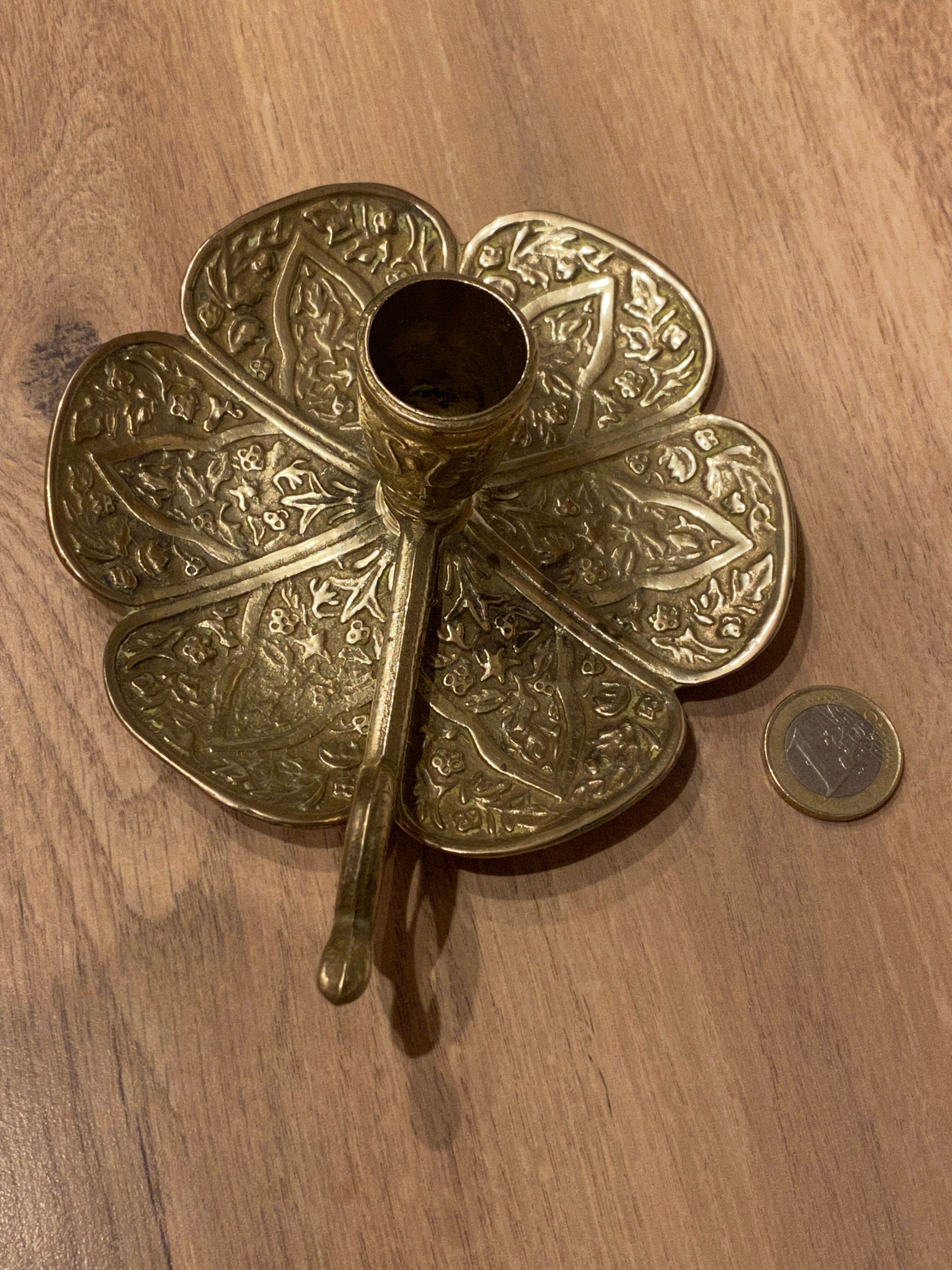 Brass candle holder on frame