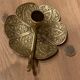 Brass candle holder on frame